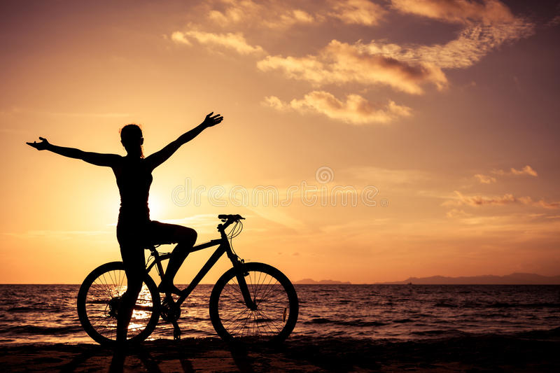 happy-woman-standing-beach-sunset-time-concept-healthy-life-65450610